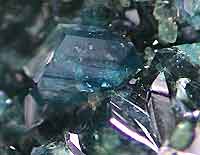 Scorodite, Pingtouling mine, Liannan, Guangdong, China, largest crystal 1 cm; John Veevaert collection and photo